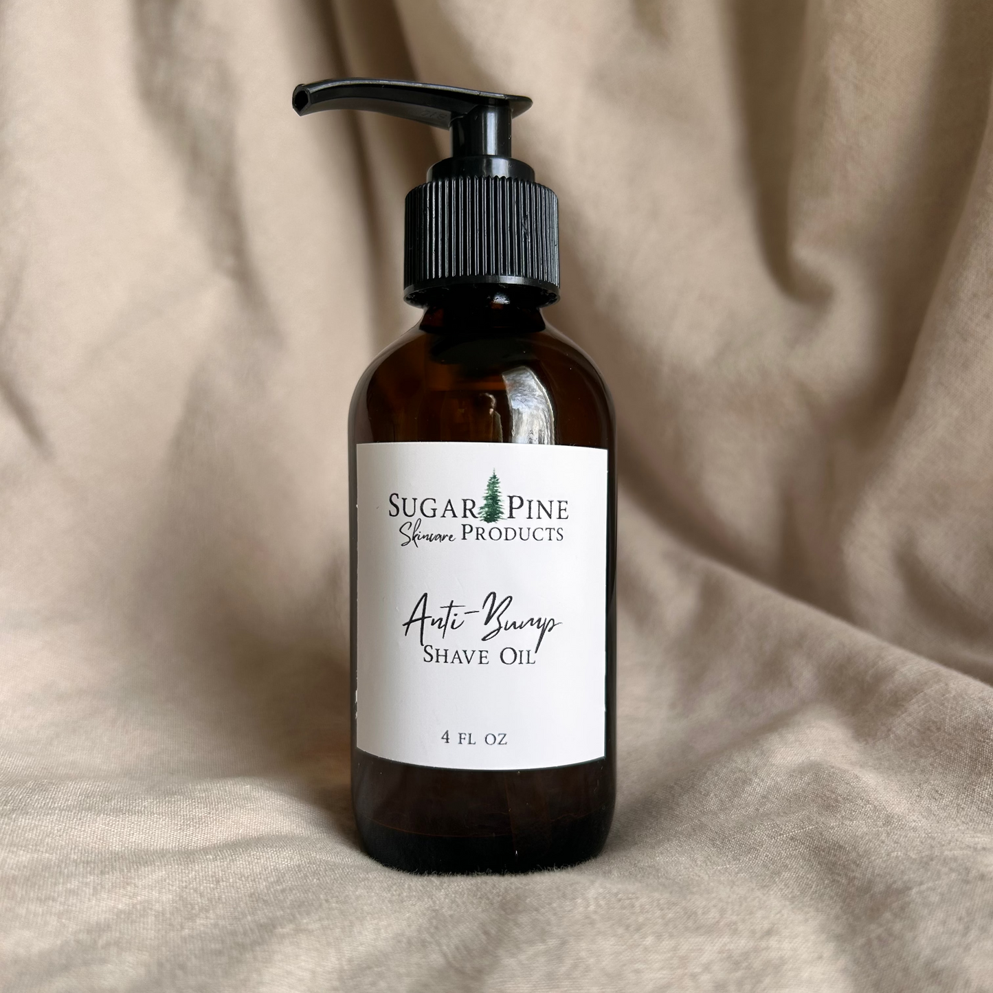 Bottle of Shave Oil with a label on a beige fabric background