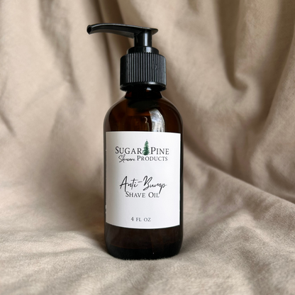 Bottle of Shave Oil with a label on a beige fabric background