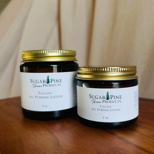 Two small jars with gold lids on a wooden surface sugar pine products all purpose tallow lotion