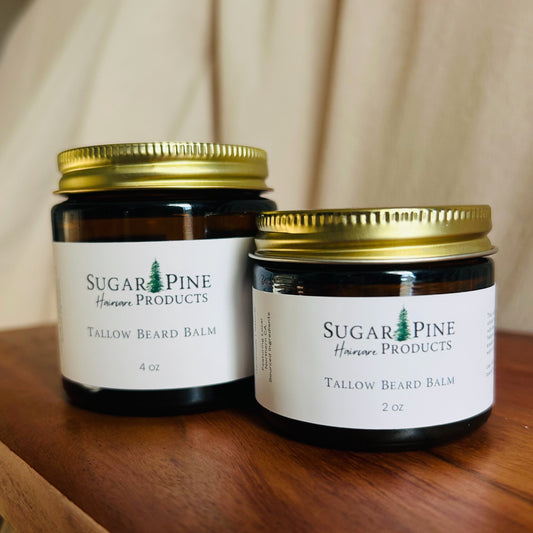 Two jars of Sugar Pine Products tallow beard balm on a wooden surface