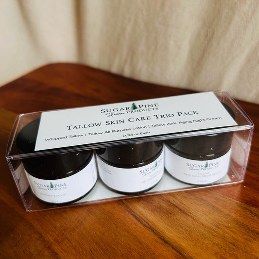 Three small jars in a clear plastic packaging on a wooden surface sugar pine products tallow trio skin care pack