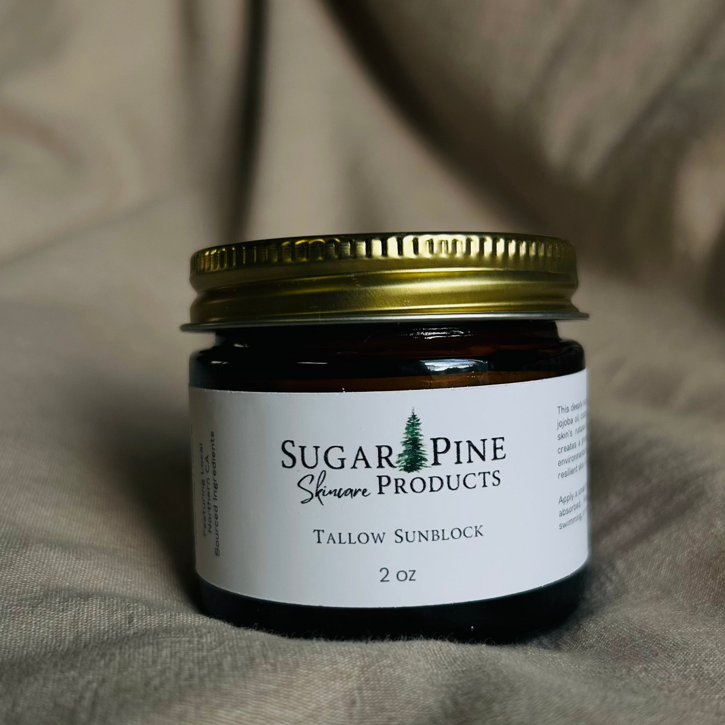 glass jar of tallow sunblock from sugar pine products